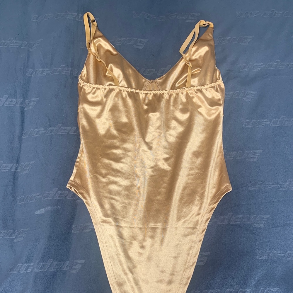 This is a beautiful gold body suit!